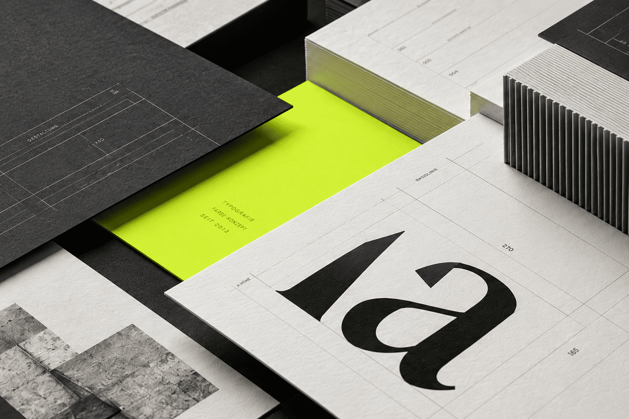 Geschichtete Papiergestaltung in Graphit, Weiß und Neongrün